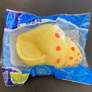Kiibru yellow conch shell squishy toy
